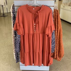 Size large Rust colored dress. Bought at a boutique. NWT. $28